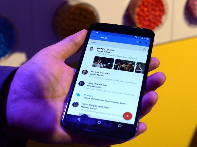 Google's lead designer for 'Inbox by Gmail' Jason Cornwell shows the app's functionalities on a nexus 6 android phone during a media preview in New York on October 29, 2014. Google ramped up its mobile arsenal, upgrading its Nexus line with a new tablet and smartphone, and unveiling its revamped Android software, to be dubbed 'Lollipop.' The US tech giant also announced the launch of a streaming media player for music, movies and videos, which can also allow users to play games via the Android TV device. AFP PHOTO/Jewel Samad