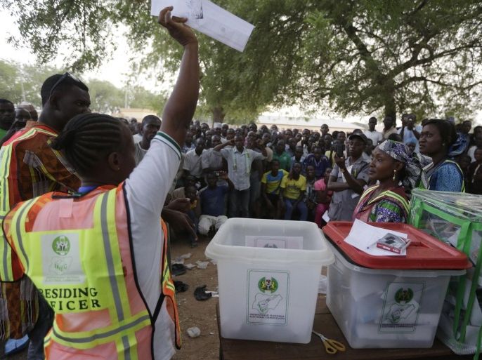 Election officials count ballot papers at the end of voting in one of the polling stations in Yola, Nigeria Saturday, March 28, 2015. Nigerians went to the polls Saturday in presidential elections which analysts say will be the most tightly contested in the history of Africa's richest nation and its largest democracy. (AP Photo/Sunday Alamba)