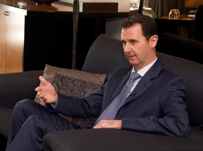 A handout photograph made available by the official Syrian Arab News Agency (SANA) shows Syrian President Bashar Assad speaking during an interview with US Foreign Affairs Magazine, in Damascus, Syria, 26 January 2015. According to SANA, Assad said the ongoing war in his country will only end with a political solution, adding that any transition must be passed by peoples referendum. EPA/SANA HANDOUT