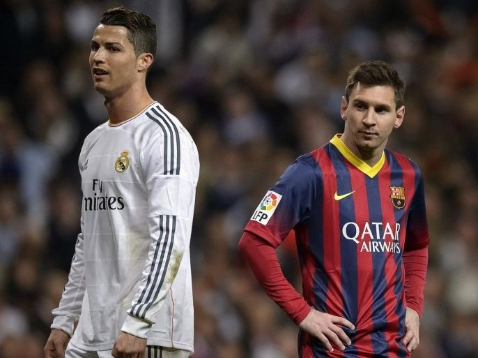 Barcelona's Argentinian forward Lionel Messi (R) stands past Real Madrid's Portuguese forward Cristiano Ronaldo during the 'El clasico' Spanish League football match Real Madrid vs Barcelona at the Santiago Bernabeu stadium in Madrid on March 23, 2014. Barcelona won 4-3. AFP PHOTO/ DANI POZO