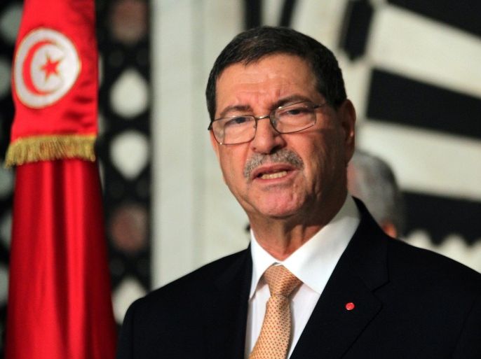 Tunisian Prime Minister Habib Essid speaks during a press conference after an attack carried out by two gunmen at Bardo International Museum on March 18, 2015 in Tunis. At least 17 foreigners were killed, they were among 19 people who died in the attack by two men armed with assault rifles on the museum, the interior ministry said. AFP PHOTO / ARBI SOUSSI