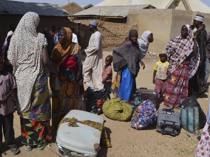 Families from Gwoza, Borno State, displaced by the violence and unrest caused by the insurgency, are pictured at a refugee camp in Mararaba Madagali, Adamawa State, February 18, 2014. President Goodluck Jonathan ordered extra troops into northeast Nigeria in May to try to crush Boko Haram, who want to carve a breakaway Islamic state out of largely Muslim northern Nigeria, where they have killed thousands of people. But the Islamists simply retreated into the remote, hilly Gwoza area bordering Cameroon, from where they have continued to mount deadly attacks that increasingly target civilians. Picture taken February 18, 2014. REUTERS/stringer (NIGERIA - Tags: POLITICS CIVIL UNREST)