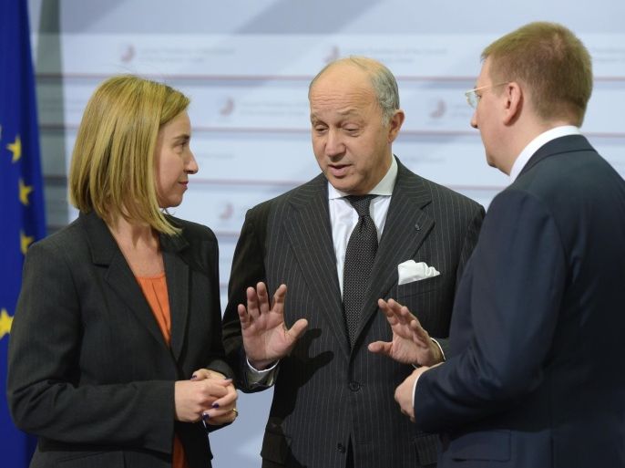 High Representative of the European Union for Foreign Affairs and Security Policy, Federica Mogherini (L), French Foreign Minister Fabius Laurent (C) and their Latvian counterpart Edgars Rinkevics (R) are seen prior to an Informal Meeting of EU Foreign Ministers in Riga, Latvia on March 6, 2015. AFP PHOTO / ILMARS ZNOTINS