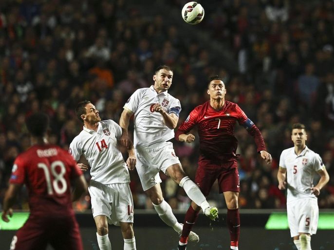 Portugal's Cristiano Ronaldo (2-R) in action against Serbian players Nemanja Matic (L) and Branislav Ivanovic (C) during the UEFA EURO 2016 qualifying Group I soccer match between Portugal and Serbia in Lisbon, Portugal, 29 March 2015.