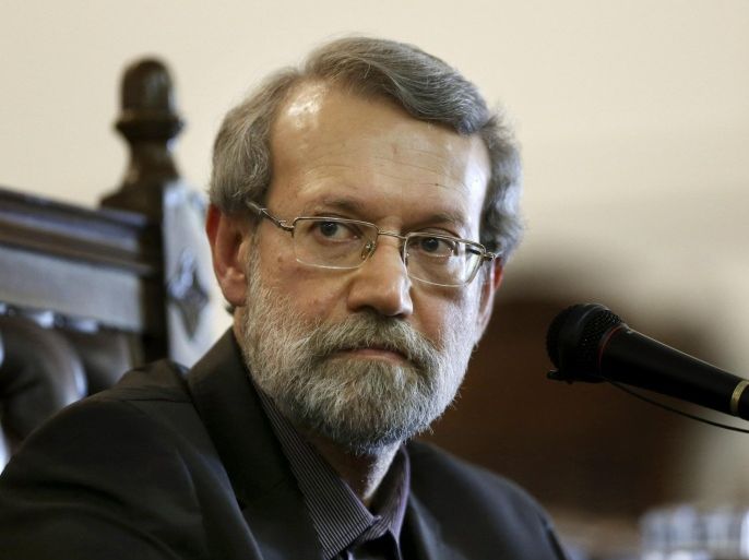 Iran's parliament speaker Ali Larijani listens to a question during a press conference at parliament in Tehran, Iran, Monday, March 16, 2015. Referring to the Iran's nuclear talks with world powers, Ali Larijani told reporters on Monday that a final nuclear deal can serve interests of both Iran and the region. (AP Photo/Vahid Salemi)