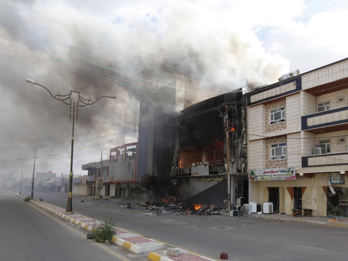 ‪المسؤولون العراقيون يقولون إن تنظيم الدولة فخخ نصف مدينة تكريت‬ (رويترز)
