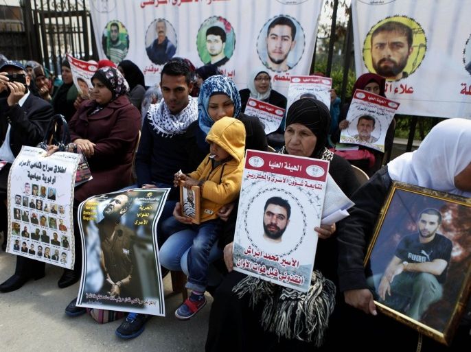 RAMALLAH, WEST BANK - APRIL 14 : Relatives and family members of Israeli-held Palestinian prisoners stage a demonstration outside the International Committee of the Red Cross office in Ramallah on April 14, 2015 to demand the release of prisoners.