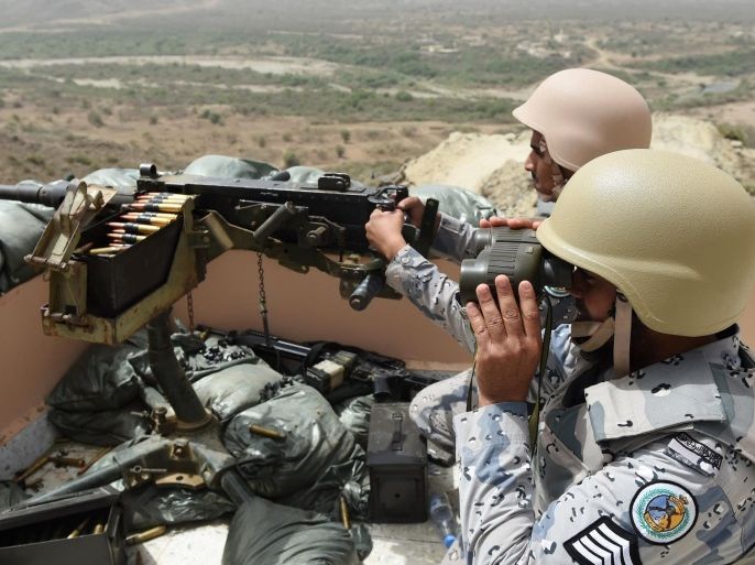 Members of the Saudi border guard are stationed at a look-out point on the Saudi-Yemeni border, in southwestern Saudi Arabia, on April 9, 2015. The Saudi-led coalition launched its air war on March 26, 2015, as the rebels closed on Yemeni President Abedrabbo Mansour Hadi's last refuge in Aden, prompting him to flee to neighbouring Saudi Arabia. AFP PHOTO / FAYEZ NURELDINE