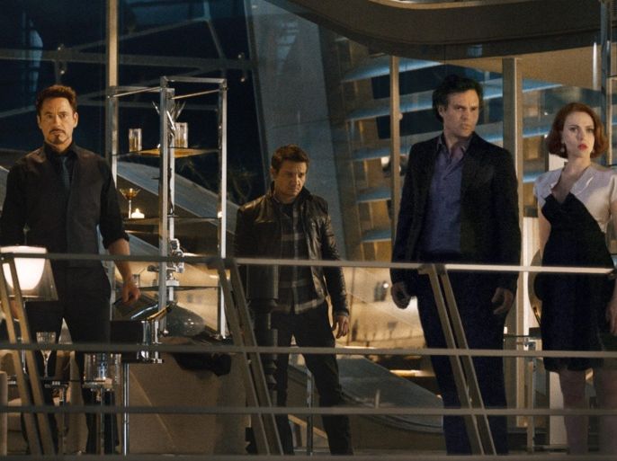 This photo provided by Disney/Marvel shows, from left, Cobie Smulders, seated, Chris Evans, Don Cheadle, Claudia Kim, Chris Hemsworth, Robert Downey Jr., Jeremy Renner, Mark Ruffalo and Scarlett Johansson in the film, "Avengers: Age Of Ultron." The movie releases in U.S. theaters on May 1, 2015. (Disney/Marvel via AP)