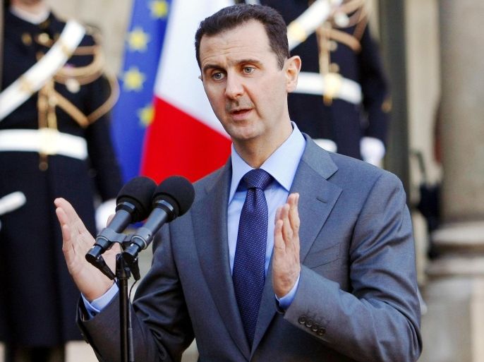 FILE - In this Thursday Dec. 9, 2010 file photo, Syria President Bashar al-Assad addresses reporters following his meeting with French President Nicolas Sarkozy at the Elysee Palace in Paris, France. Syrian President Bashar Assad says the French and Syrian intelligence services have had “some contacts” over the fight against the Islamic State group but denied that there is any cooperation between them. Assad made the remarks in a taped interview with French television station France 2 broadcast Monday April 20, 2015. (AP Photo/Remy de la Mauviniere, File)