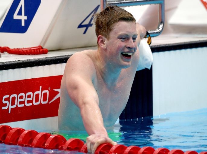 LONDON, ENGLAND - APRIL 17: Adam Peaty of County of Derby celebrates wining the Men's 100m Breaststroke Final and breaking the World Record on day four of the British Swimming Championships at the London Aquatics Centre on April 17, 2015 in London, England.