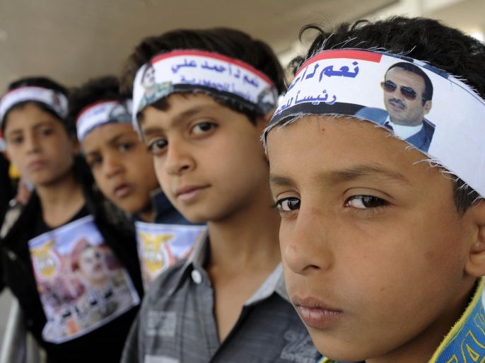 SANAA, YEMEN - MARCH 13: Yemeni children who support former Yemeni President Ali Abdullah Saleh's son Ahmed Ali Saleh stage a protest to end political problems in the country and demand early presidential elections at Sebin square in Sanaa, Yemen on March 13, 2015.