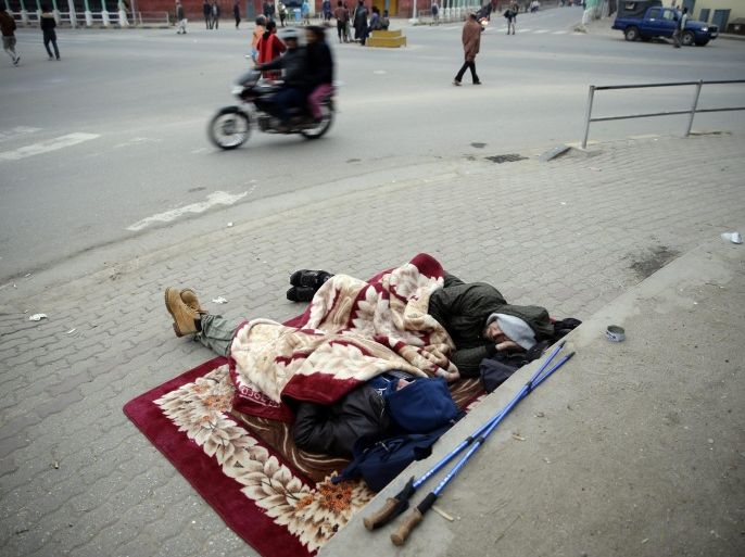 Tourists sleep at a street during early morning a day after a massive earthquake, in Kathmamdu, Nepal, 26 April 2015. More than 1,800 people were confirmed dead and many more were feared trapped under rubble on 25 April in Nepal's worst earthquake in more than 80 years. The official death toll from the magnitude-7.9 earthquake reached 1,805, the Home Ministry said. One official said that figure could triple. Saturday's quake flattened buildings across the country and razed many historic landmarks. It was also felt in China, Bangladesh and India, where more than 40 deaths were reported. Buildings in the ancient centre of Kathmandu were destroyed, leaving mounds of timber and rubble, local television reported.