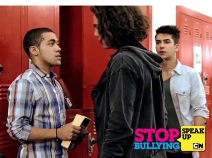 Teen actors from Cartoon Network&apos;s Dude, What Would Happen reenact a common bullying scene. CJ Manigo (far left) is being bullied by Jackson Rogow (center) while classmate, Ali Sepasyar, stands by and watches helplessly. Cartoon Network&apos;s STOP BULLYING: SPEAK UP campaign takes a new stand against bullying by teaching the bystander to act when they see someone being bullied. The initiative&apos;s website, www.StopBullyingSpeakUp.com, has resources for kids and adults to learn safe, effective ways to prevent and stop bullying.