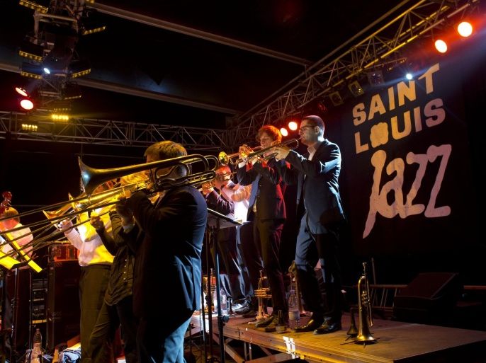 In this Friday, May 17, 2013 photo, members of the German jazz band BujazzO perform on the main stage at the Saint-Louis Jazz Festival, in Saint-Louis, Senegal. The 21st edition of the annual festival in Saint Louis, once the capital of colonial French West Africa, included musicians from Africa, Europe, and the U.S.(AP Photo/Rebecca Blackwell)