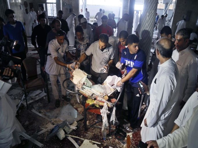 People search the wreckage following a suicide attack on the Shiite Imam Ali mosque in a village in the eastern province of Qatif, Saudi Arabia, 22 May 2015. According to intial reports some ten people are thought to have been killed in the explosion when the Mosque was filled with an estimated 150 Shiites, a minority, roughly 10-15 percent, population in the mainly Wahhabi country, and living for the most part in Qatif and al-Ahsa.