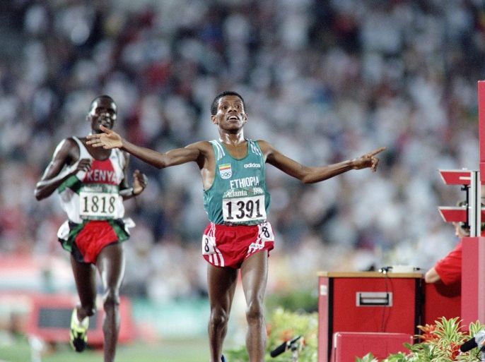 A picture taken on July 29, 1996 shows Haile Gebreselassie from Ethiopia (R) reaching the finish line ahead of Paul Tergat from Kenya during the men's 10.000 at the Olympic Stadium in Atlanta, Georgia. Gebreselassie won the event in a time of 27 min 07.34 sec, a new Olympic record, beating Paul Tergat and Salah Issou from Morocco.