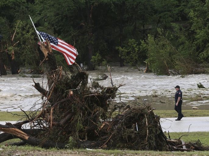 Hays County Precinct Four Deputy Constable John Ellen patrols River Road at the 7A Resort in Wimberley, Texas, USA, 25 May 2015. Heavy rains led to historical floods along the Blanco River in Wimberley. Twelve people remain missing. EPA/JERRY LARA