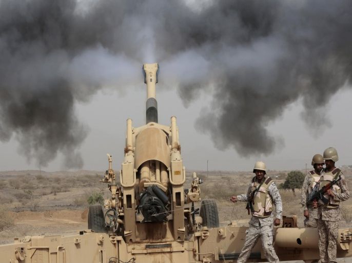 FILE - In this Monday, April 20, 2015 file photo, Saudi soldiers fire artillery toward three armed vehicles approaching the Saudi border with Yemen in Jazan, Saudi Arabia. (AP Photo/Hasan Jamali, File)