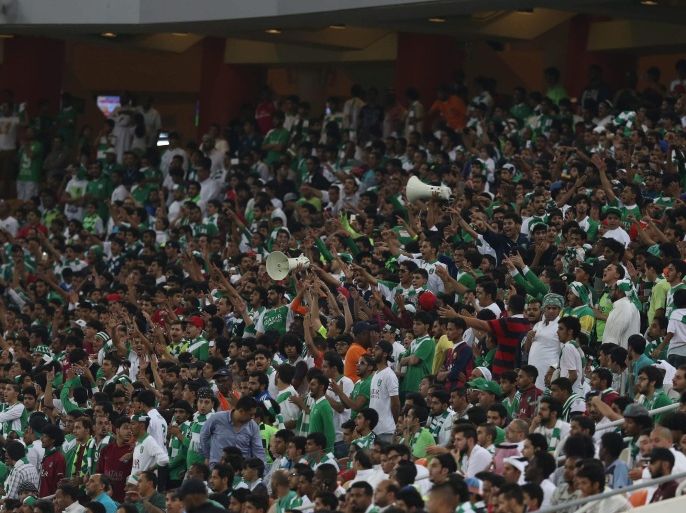Al-AhliÂ fans cheer for their team during the Saudi Professional League soccer match between Al-Ahli and Najran atÂ King Abdullah Al Jawhara International Stadium in Jeddah, Saudi Arabia, 11 March 2015.