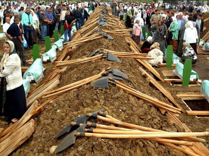 (FILE) A file picture dated 11 July 2003 shows people attending the burial of 282 Bosnian Muslim men on the eighth anniversary of the Srebrenica Massacre, in the eastern Bosnian Serb town of Srebrenica. July 2015 marks the 20-year anniversary of the Srebrenica Massacre that saw more than 8,000 Bosniak men and boys killed by Bosnian Serb forces during the Bosnian war. EPA/FEHIM DEMIR PLEASE REFER TO THIS ADVISORY NOTICE (epa04766937) FOR FULL PACKAGE TEXT *** Local Caption *** 00026789