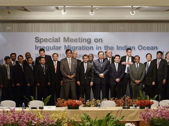 Thai Foreign Minister and deputy Prime Minister Tanasak Patimapragorn (C) poses for a group picture along with delegates from 17 nations and observers during an international meeting on migration in the Indian Ocean in Bangkok on May 29, 2015. Myanmar rebuked the UN on May 29 for calling on the country to address the root causes of the exodus of Rohingya Muslims from its shores, saying it is being 'singled out' for criticism as an international meeting exposed tensions over Southeast Asia's migrant crisis. AFP PHOTO / Christophe ARCHAMBAULT