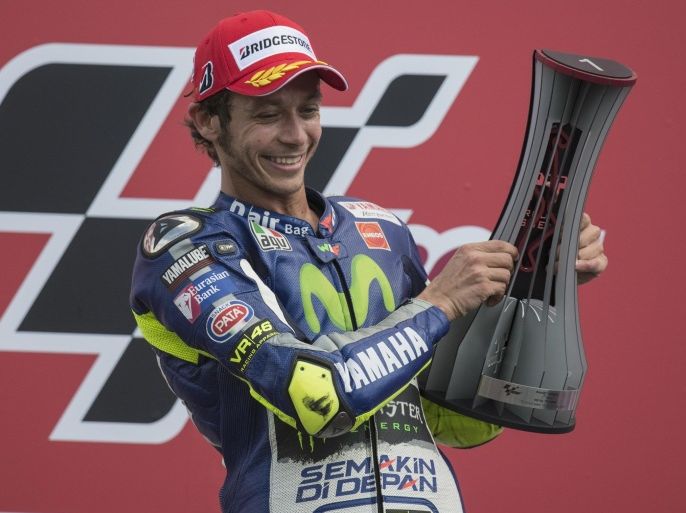 ASSEN, NETHERLANDS - JUNE 27: Valentino Rossi of Italy and Movistar Yamaha MotoGP celebrates the victory on the podium at the end of the MotoGP race during the MotoGP Netherlands - Race at on June 27, 2015 in Assen, Netherlands.