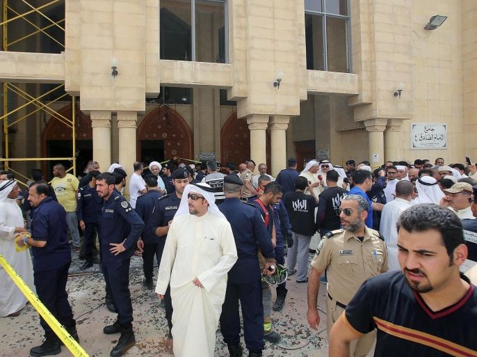 Kuwaiti security forces gather outside the Shiite Al-Imam al-Sadeq mosque after it was targeted by a suicide bombing during Friday prayers on June 26, 2015, in Kuwait City. The Islamic State group-affiliated group in Saudi Arabia, calling itself Najd Province, said militant Abu Suleiman al-Muwahhid carried out the attack, which it claimed was spreading Shiite teachings among Sunni Muslims. AFP PHOTO / YASSER AL-ZAYYAT