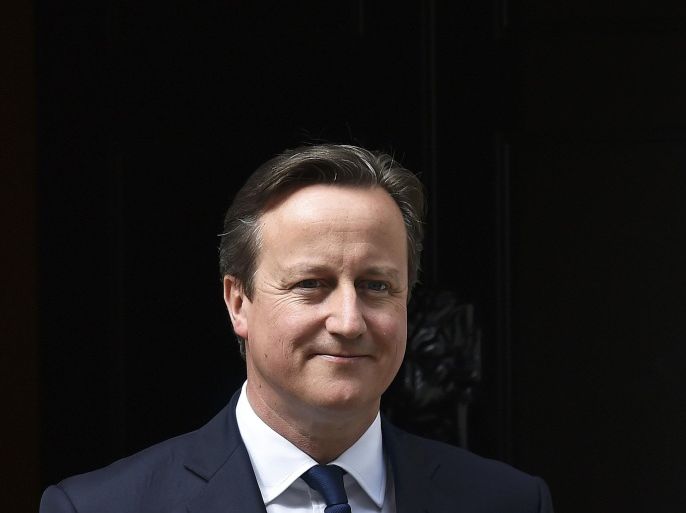 Britain's Prime Minister David Cameron waits to greet his Ukrainian counterpart Arseniy Yatsenyuk at Number 10 Downing Street in London, Britain July 15, 2015. Cameron on Wednesday said that Greece needed to be granted relief from its debts, backing an International Monetary Fund study on the subject. REUTERS/Toby Melville