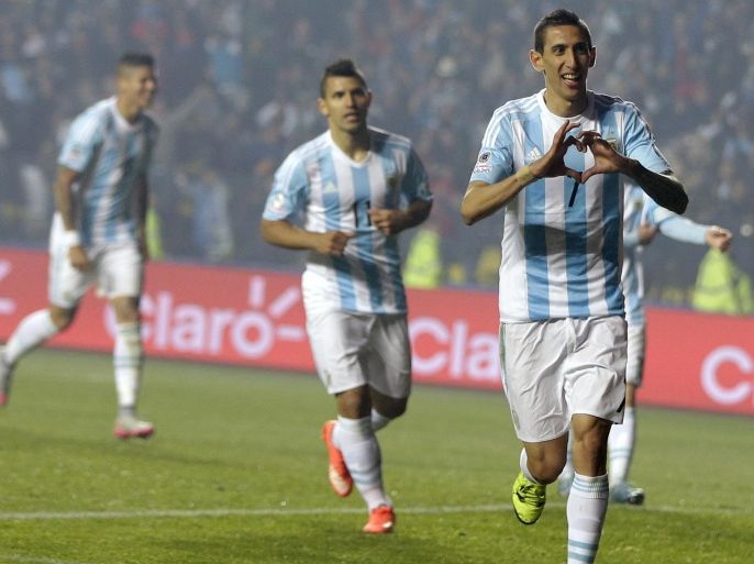 Argentina's Angel Di Maria, right, celebrates after scoring his second goal and his team's fourth against Paraguay during a Copa America semifinal soccer match at the Ester Roa Rebolledo Stadium in Concepcion, Chile, Tuesday, June 30, 2015. (AP Photo/Ricardo Mazalan)