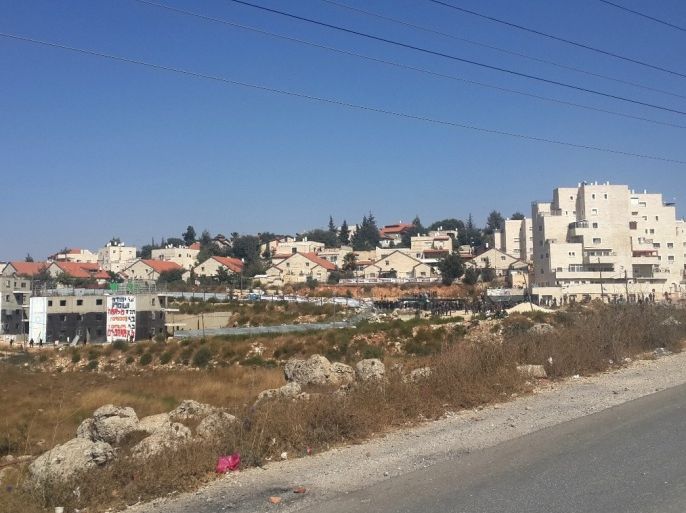 فلسطين 28 تموز 2015 صورة لمستعمرة بيت ايل الثلاثاء حيث يظهر المبنيان باللون الأسود على أراضي الحاج عبد الرحمن قاسم