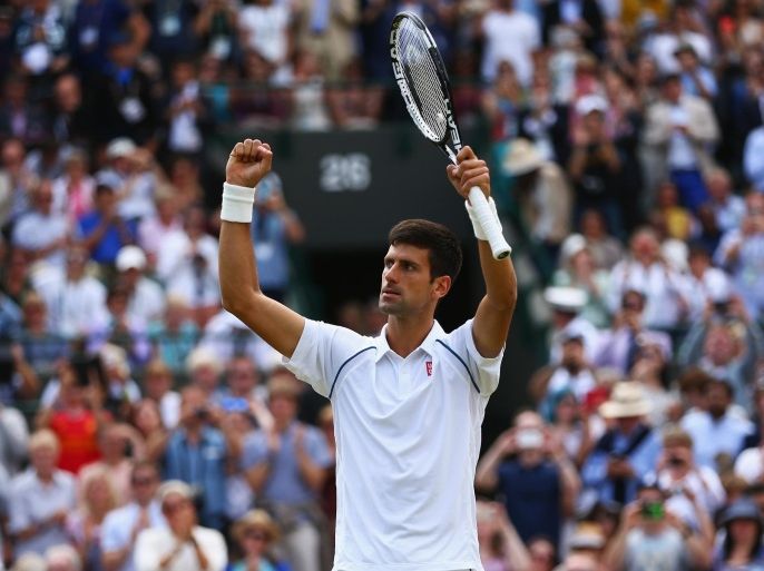 LONDON, ENGLAND - JULY 07: Novak Djokovic of Serbia celebrates after winning his Gentlemens Singles Fourth Round match against Kevin Anderson of South Africa during day eight of the Wimbledon Lawn Tennis Championships at the All England Lawn Tennis and Croquet Club on July 7, 2015 in London, England.