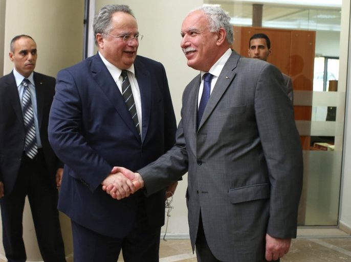 RAMALLAH, WEST BANK - JULY 07 : Greece's Foreign Minister Nikos Kotzias (C) meets with Palestinian Foreign Minister Riyad Al-Maliki (R) in the West Bank city of Ramallah on July 07, 2015.