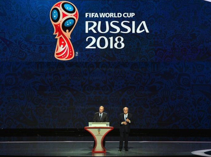 SAINT PETERSBURG, RUSSIA - JULY 25: Vladimir Putin, President of Russia speaks as FIFA President Joseph S. Blatter loosk on during the Preliminary Draw of the 2018 FIFA World Cup in Russia at The Konstantin Palace on July 25, 2015 in Saint Petersburg, Russia.