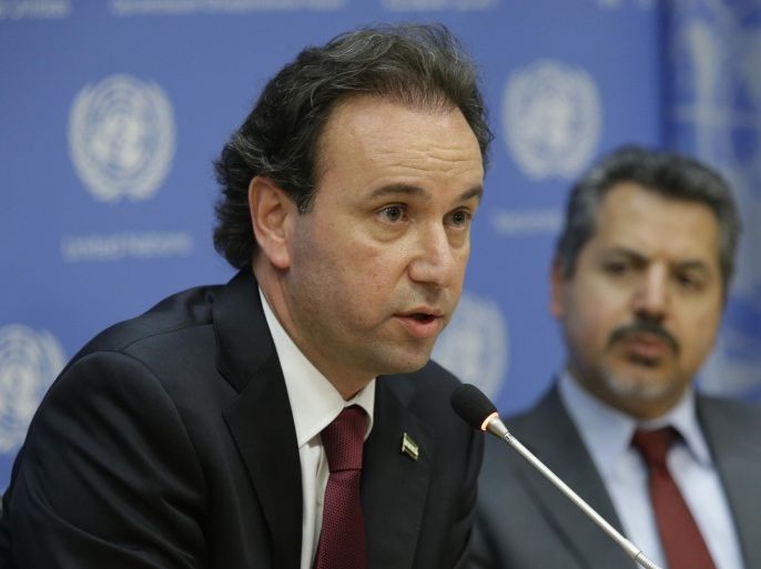 Khaled Khoja, President of the Coalition of Syria Revolution and Opposition Forces, speaks to reporters during a news conference Wednesday, April 29, 2015, at United Nations headquarters. At right is Najib Ghadbian, Special Representative to the United States and United Nations. (AP Photo/Mary Altaffer)