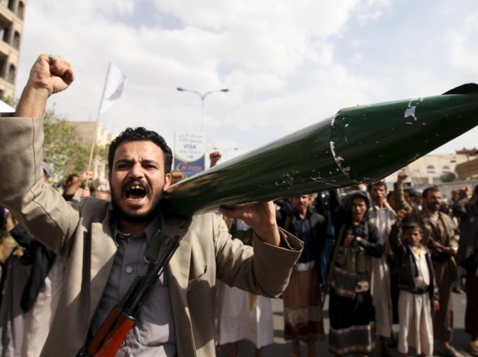 A Houthi follower carries a mock missile as he shouts slogans during a demonstration against the United Nations in Sanaa, Yemen, July 5, 2015. Hundreds of supporters of the Iran-backed Houthi rebels took to the streets of the Yemeni capital on Sunday to protest against the United Nations and its alleged support of Yemen's exiled President Abd-Rabbu Mansour Hadi. REUTERS/Mohamed al-Sayaghi