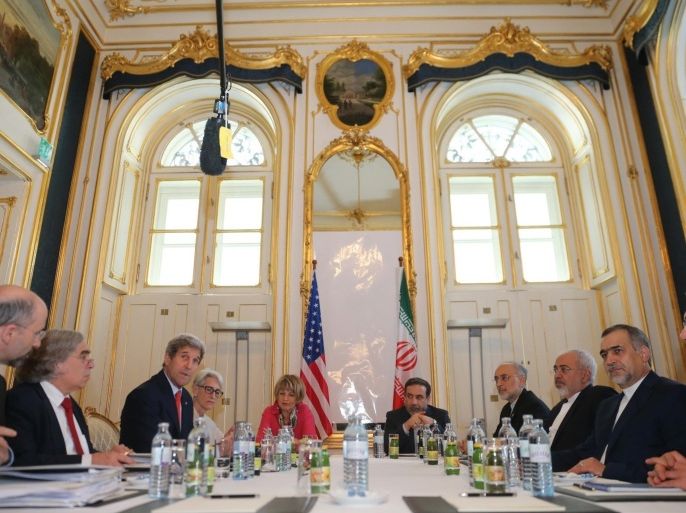 VIENNA, AUSTRIA - JULY 3: (L to R) US Senior Director at the National Security Council Robert Malley, Secretary of Energy Ernest Moniz, U.S. Secretary of State John Kerry, Deputy Secretary General for Political Affairs, Helga Schmid, Iranian Deputy Foreign Minister Abbas Araghchi, Iran's Atomic Energy Organization head Ale Akbar Salehi, Iranian Foreign Minister Javad Zarif, Iranian President Hassan Rouhani's brother Hussain Faredun, Iran's deputy foreign minister and one of Iran's chief negotiators, Majid Ravanchi are seen during a meeting Palais Coburg hotel where the nuclear talks between the E3+3 (France, Germany, UK, China, Russia, US) and Iran are being held, in Vienna, Austria on July 03, 2015.