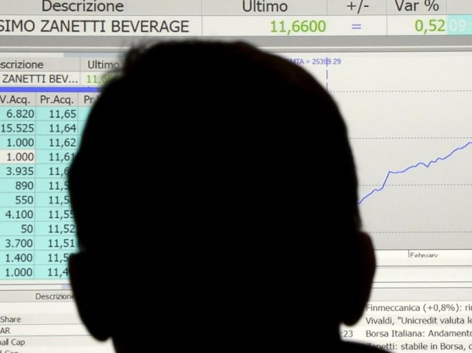 A person looks at an electronic board displaying Massimo Zanetti Beverage group's shares debut at the Milan's Stock Exchange, Italy, June 3, 2015. Italian coffee maker Massimo Zanetti Beverage's share price edged up on Wednesday, the first day of trading on the Milan bourse following its initial public offering. REUTERS/Stefano Rellandini