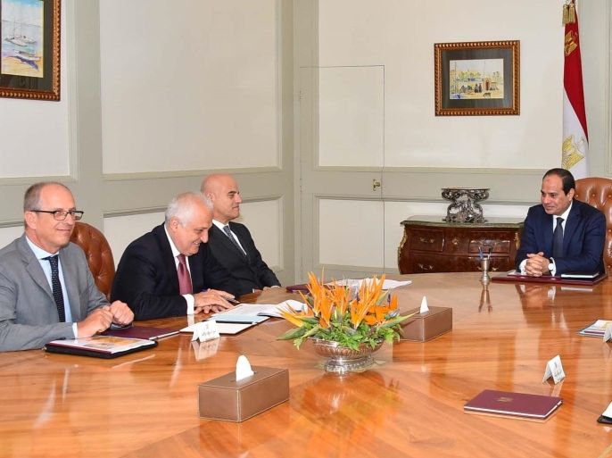 In this Saturday, Aug. 29, 2015 photo provided by Egypt's state news agency MEAN, Eni CEO Claudio Descalzi, third left, and his delegation meet with Egyptian President Abdel-Fattah el-Sissi, center, and an Egyptian delegation, in Cairo, Egypt. The Italian energy company Eni SpA announced Sunday, Aug. 30, 2015, it has discovered a "supergiant" natural gas field off Egypt, describing it as the "largest-ever" found in the Mediterranean Sea. Eni said the discovery — made in its Zohr prospect "in the deep waters of Egypt" — could hold a potential 30 trillion cubic feet of gas over an area of 100 square kilometers (38.6 square miles). (MEAN via AP)