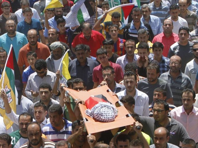 Mourners carry the body of 18-month-old Palestinian baby Ali Dawabsheh, who was killed after his family's house was set on fire in a suspected attack by Jewish extremists in Duma village near the West Bank city of Nablus July 31, 2015. Suspected Jewish attackers torched a Palestinian home in the occupied West Bank on Friday, killing an 18-month-old toddler and seriously injuring three other family members, an act that Israel's prime minister described as terrorism. REUTERS/Abed Omar Qusini