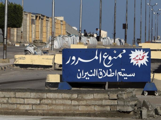 A sign outside the security headquarters warns vehicles not to proceed or they will be shot, in el-Arish, 290 kilometers (180 miles) east of Cairo, North Sinai, Egypt, Saturday, Jan. 31, 2015. Egyptian President Abdel Fattah al-Sissi told the nation in a televised address Saturday to prepare for a long fight to defeat Islamic extremists following a wave of attacks on security forces in the Sinai Peninsula. An Islamic State-linked group in Egypt claimed responsibility for a string of bomb and gun attacks Thursday night targeting Egyptian military positions that killed at least 30 security force members. (AP Photo)