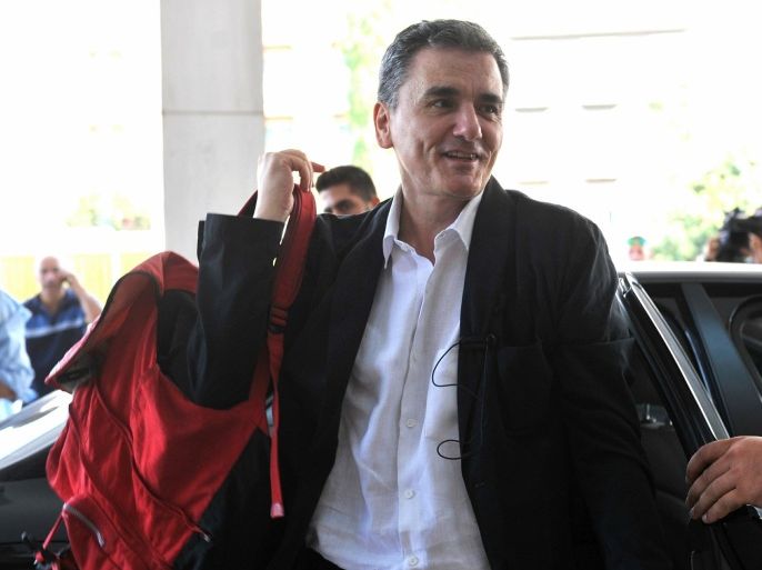 Greek Finance Minister Euclid Tsakalotos arrives for a meeting with senior negotiators at a hotel in Athens, on Friday, July 31, 2015. Greece's talks with its international creditors on a third bailout worth 85 billion euros ($93 billion) shifted into a higher gear on Friday, with lead negotiators from the European Union and International Monetary Fund meeting key ministers in Athens. (Giannis Kotsiaris/InTime News via AP) GREECE OUT