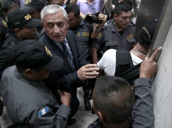 Former President Otto Perez leaves after a hearing at the Supreme Court of Justice in Guatemala City, Guatemala September 4, 2015. Fighting graft accusations, Perez said on Friday he could have made "10 or 15 times" the money he is accused of stealing if he had taken bribes offered by powerful Mexican drug lord Joaquin "El Chapo" Guzman. REUTERS/Jose Cabezas