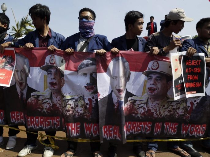 Indonesian students hold banners with pictures of Israel's Prime Minister Benjamin Netanyahu, Egypt's President Al-Sisi and Adolf Hitler during a protest against President Al-Sisi's upcoming visit in Jakarta, Indonesia, 03 September 2015. Al-Sisi is expected to visit Indonesia on 04 September as part of his Asia tour.