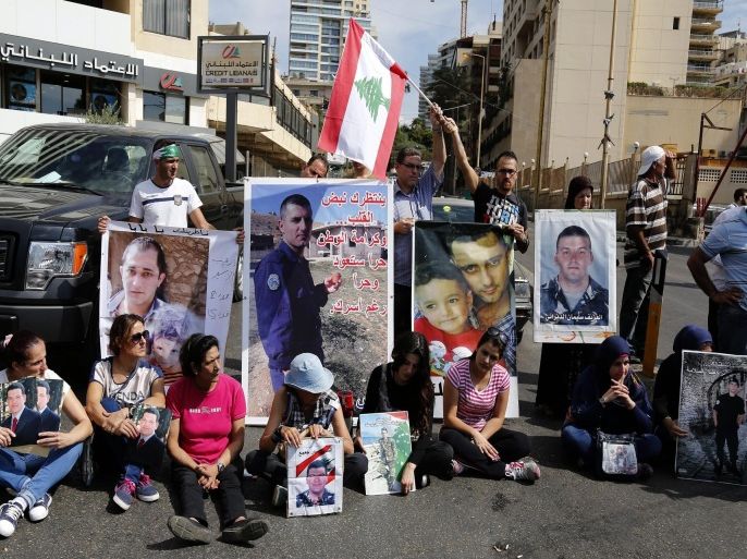 Relatives of Lebanese soldiers, kidnapped since August 2014 by militants affiliated with the Islamic State (IS) and al-Qaeda linked al-Nusra Front (JAN), carry their pictures as they block the corniche of Rawcheh, Beirut, Lebanon, 06 October 2015. Relatives of kidnapped Lebanese soldiers are calling on the government to take action to secure the release of the captives. 29 soldiers were abducted following clashes between Lebanese security forces and militants suspected of being part of JAN and IS on 02 August 2014, near the town of Arsal close to the Syrian border.
