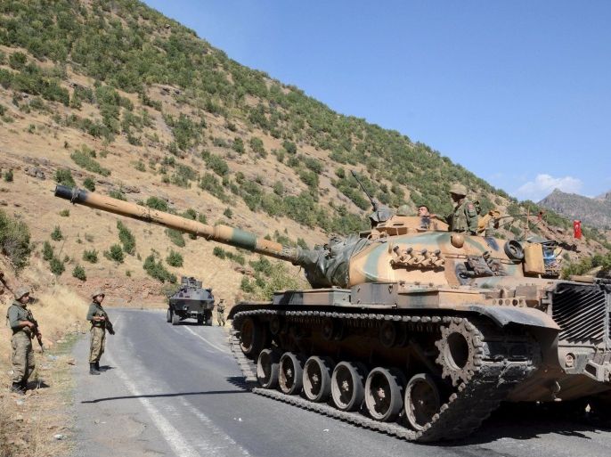 Turkish soldiers in a tank and an armored vehicle patrol on the road to the town of Beytussebab in the southeastern Sirnak province, Turkey, September 28, 2015. Five children were wounded on Monday when a bomb tore through a street in the Turkish city of Diyarbakir, hospital officials said, where deadly clashes in recent weeks have followed the collapse of ceasefire by Kurdish militants. A separate blast in the town of Tatvan wounded five soldiers when their vehicle passed over an explosive left in a ditch by the road, security sources said. The most intense fighting since the 1990s has engulfed Turkey's mainly Kurdish southeastern region since July when Ankara launched air strikes against the armed Kurdistan Workers Party (PKK) in Turkey and Iraq. More than 100 security personnel and hundreds of militants have been killed. REUTERS/Stringer