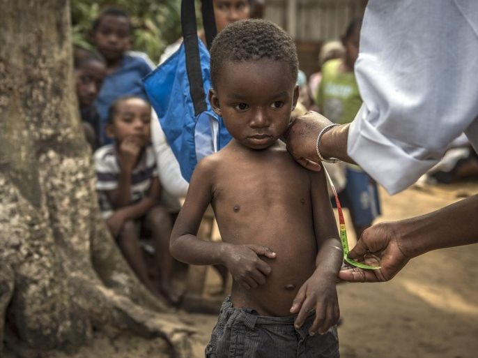 Four-year-old Bonne Chance gets a mid upper arm contour measurement to determine his nutrition status at a UNICEF supported community nutrition site in Fort Dauphin, Madagascar, 24 September 2015. The purpose of the centre is to provide counselling services as well as monitor and keep kids healthy and nourished. A severe food and nutrition crisis is affecting southern Madagascar with 200,000 people being affected, of which 40,000 are children under 5. Chronic malnutrition, also termed stunting, increases child mortality and hinders brain development, school performance and future earnings. Madagascar is one of the poorest countries in the world.