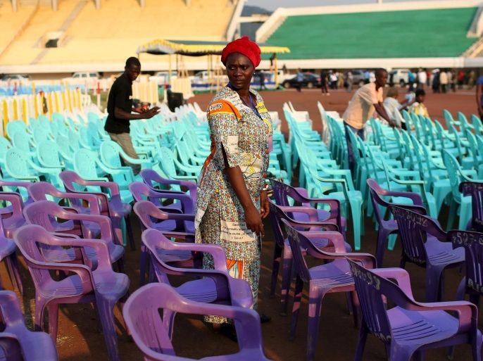 A woman organises chairs at the Barthelemy Boganda Sport Stadium, a day before the visit of Pope Francis, Bangui, Central African Republic, November 28, 2015. REUTERS/Siegfried Modola