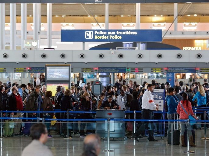 Passesngers queue at the border police control inside the airport Charles de Gaulle in Paris, France, 14 November 2015. The French government declared a state of emergency, tightened border controls and mobilized 1,500 soldiers in consequence to the 13 November Paris attacks. At least 120 people have been killed in a series of attacks in Paris on 13 November, according to French officials. Eight assailants were killed, seven when they detonated their explosive belts, and one when he was shot by officers, police said.