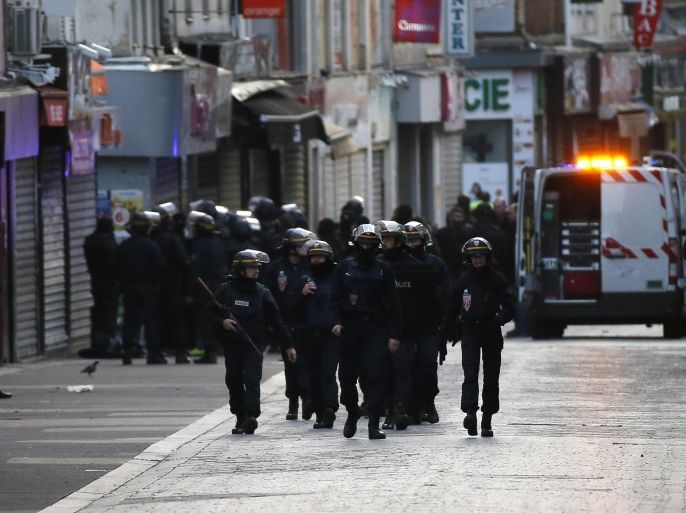 Police stand guard near the site were a raid happened in the city center of Saint Denis, near Paris, France, 18 November 2015. Shots were heard as police raided a northern Paris suburb early 18 November in connection with last week's terrorist attacks. According to media reports, two people were dead, several police officers were injured and at least three people were arrested.